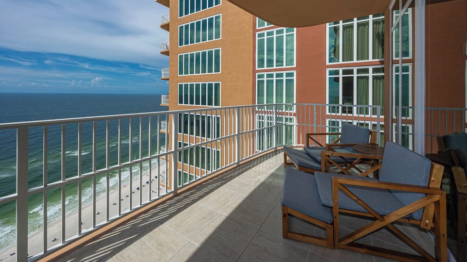 Lounge on the balcony overlooking the refreshing pool and beach area and nap with the sound of waves and seagulls