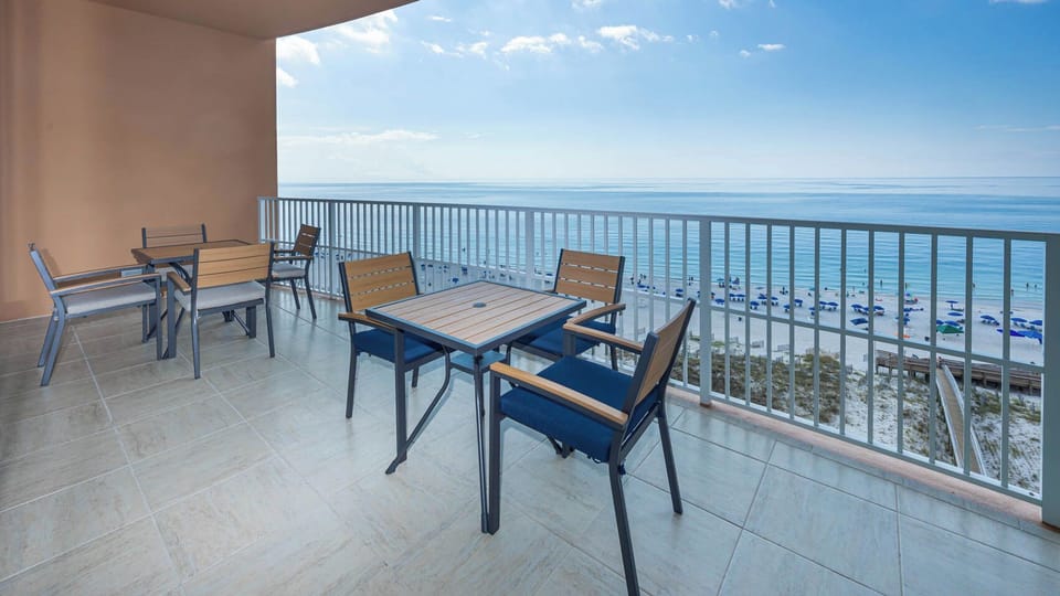 Soak up gulf views from the balcony table while listening to waves and watch the horizon disappear into the sky