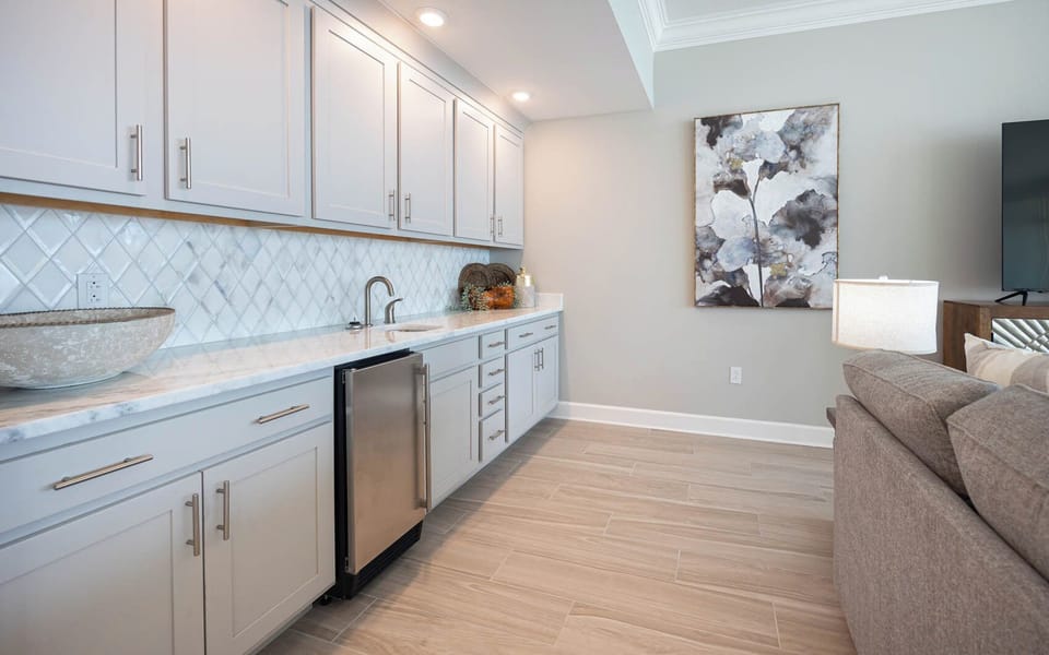 Grab a chilled drink from the fridge or create your favorite cocktail at the wet bar