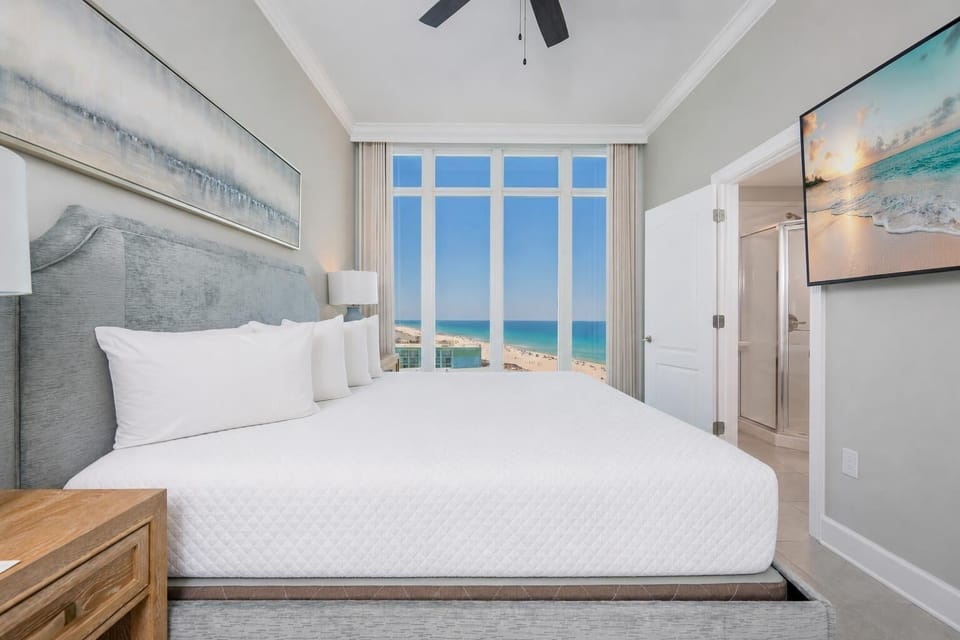 Your guest suite offers restful nights with calming views of the shore through tall windows