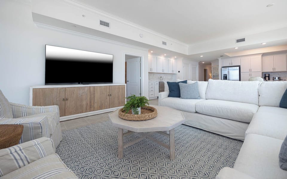 Stretch out on the roomy couch and stream your favorite shows on the large TV