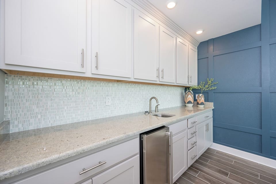 Grab a chilled drink from the fridge or create your favorite cocktail at the wet bar