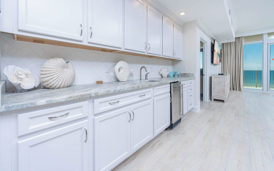 Grab a chilled drink from the fridge or create your favorite cocktail at the wet bar