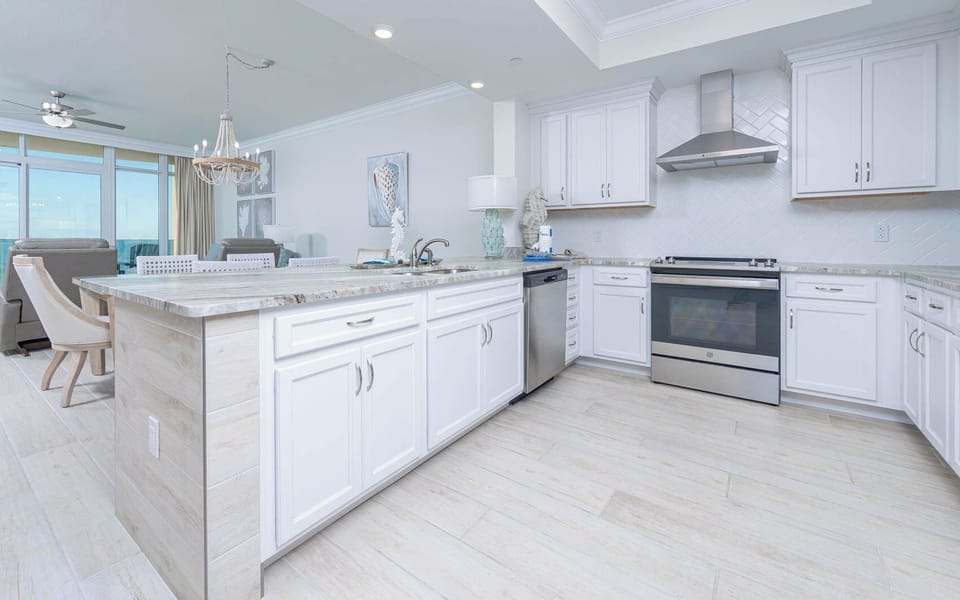 Upgrade your culinary experience in this elegant kitchen with modern appliances and stylish countertops