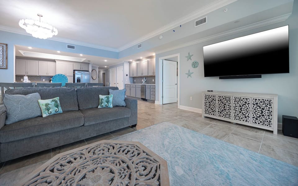 Gather in this welcoming living space and enjoy stunning beach views through the windows