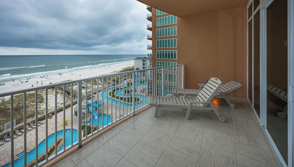 Lounge on the balcony overlooking the refreshing pool and beach area and nap with the sound of waves and seagulls