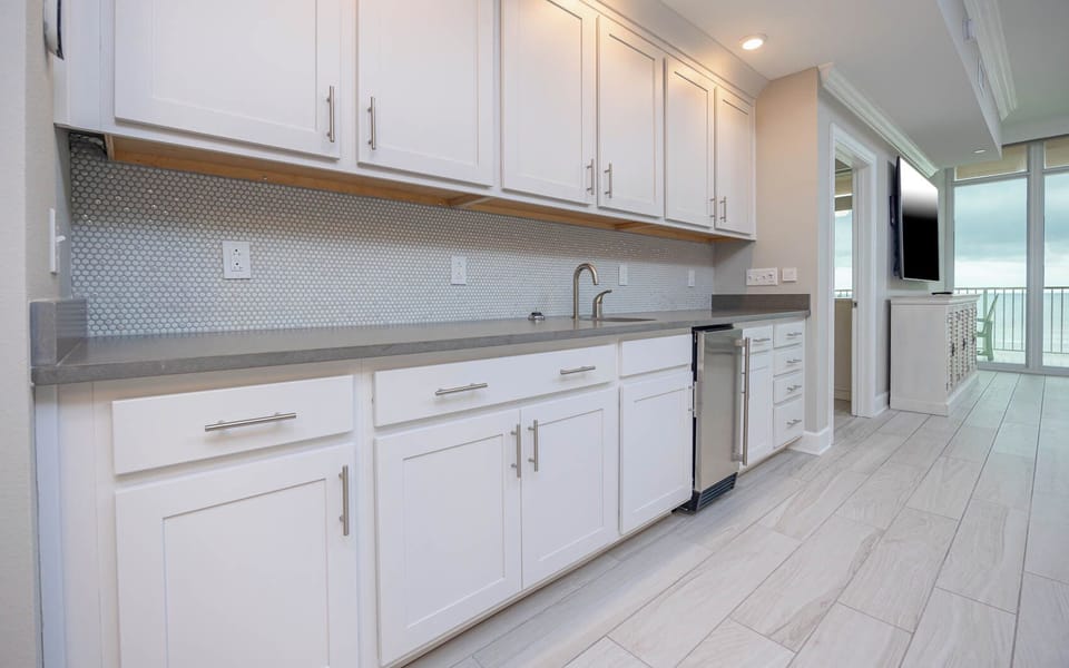 Grab a chilled drink from the fridge or create your favorite cocktail at the wet bar