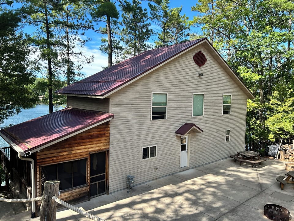Front of cabin and patio with fire pit