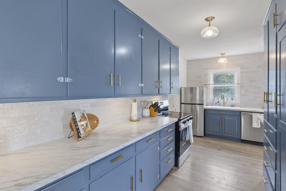 Our newly updated kitchen features stainless appliances, ample counter space, and fully stocked cabinets—perfect for cooking meals together.