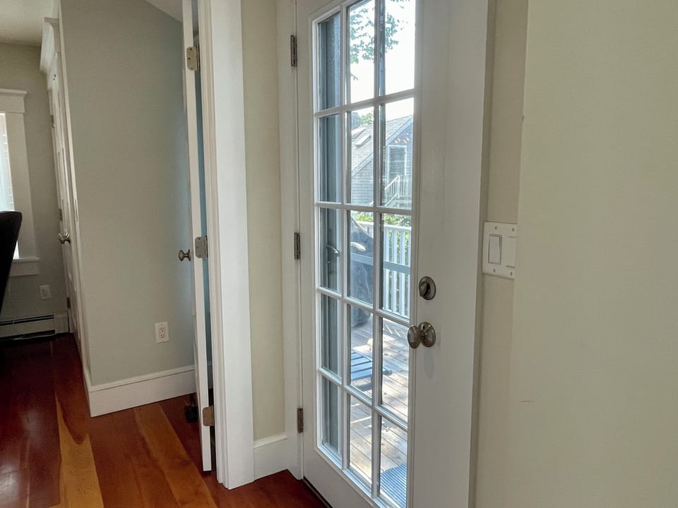 Grilling and sunning deck located off kitchen and primary bedroom