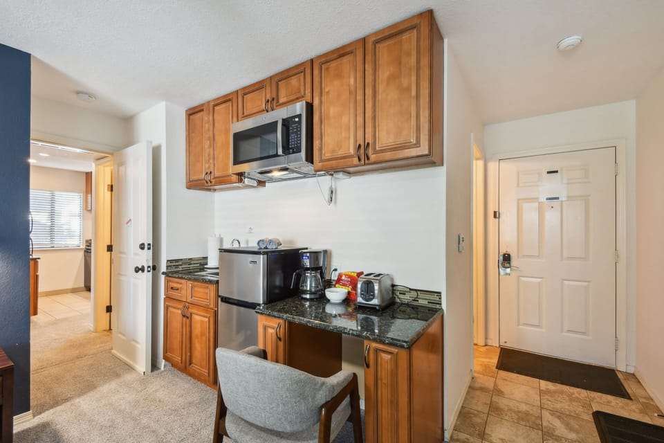 Has a mini fridge and freezer, microwave, coffee pot, and toaster.