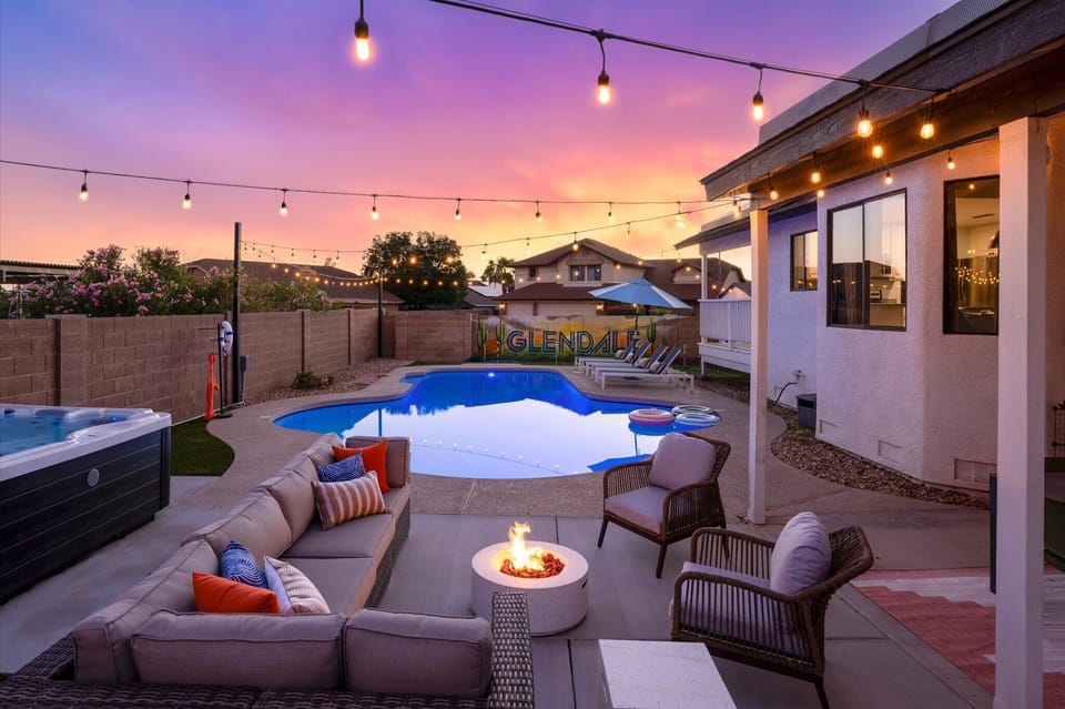 Gather around our fire pit and enjoy the sunset—perfect moments await in our cozy outdoor lounge!