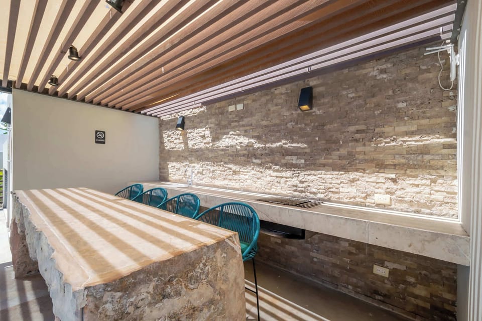 Enjoy your meals al fresco in this BBQ area and bar