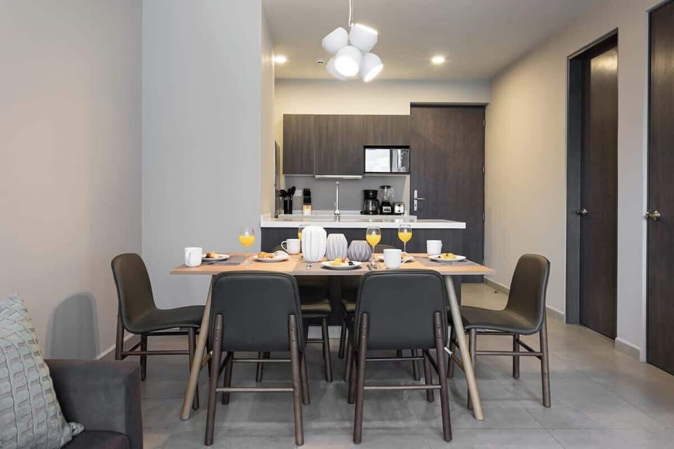 An open floor plan that includes the kitchen, dining and sitting areas. 