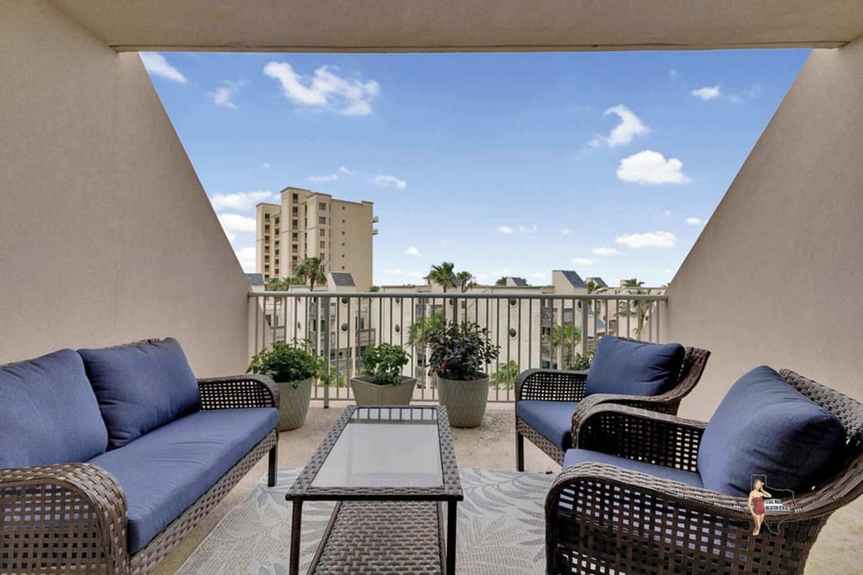 Sit back and relax on cushioned seating on your private balcony.