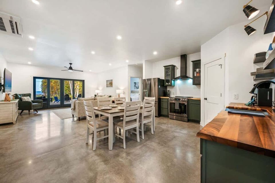 Enjoy a seamless flow from the dining area to the living space in this open-concept design. Open the patio doors to extend your entertaining area outdoors, perfect for hosting the entire family.