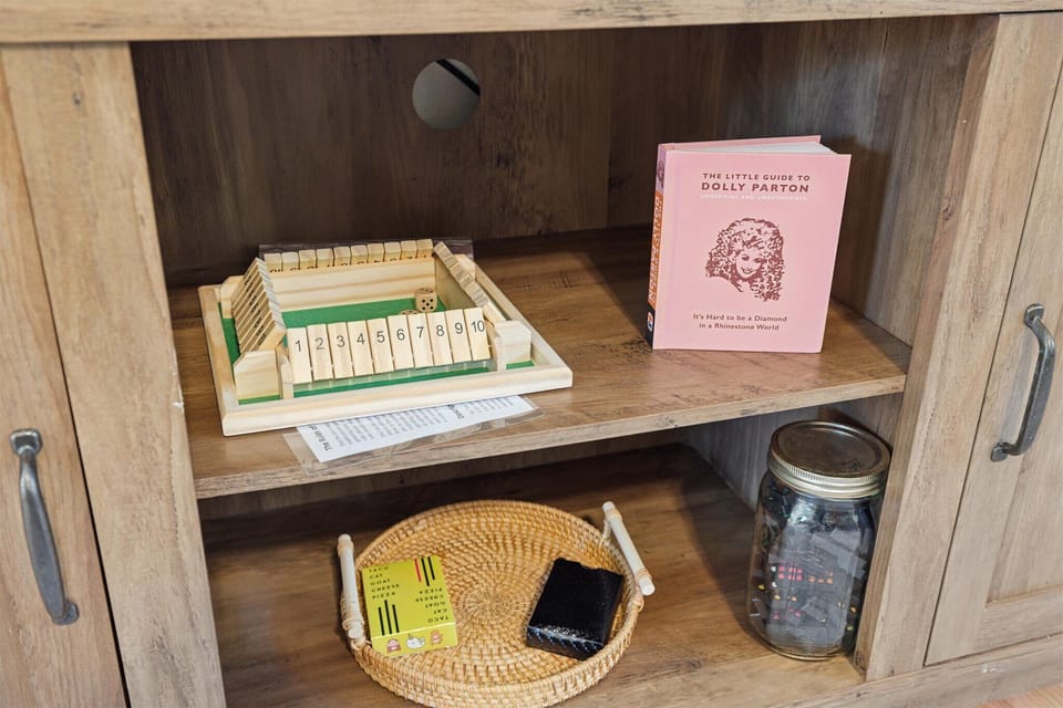 Entertainment Corner: Enjoy games and a delightful Dolly Parton book for endless fun!