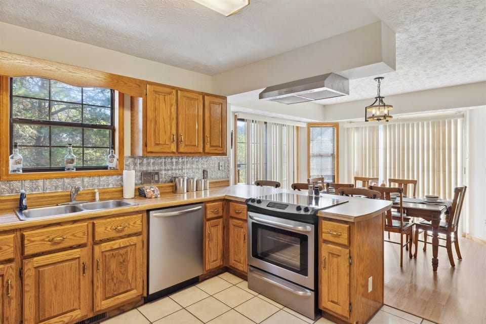 Spacious kitchen with modern appliances and sunny dining area!