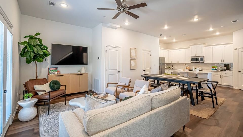 Kick back in a stylish, open-concept living space designed for comfort and connection. Whether you're debriefing after a Rangers game, watching pre-game coverage on the smart TV or just relaxing with your crew—The Ryan's living area has you covered.