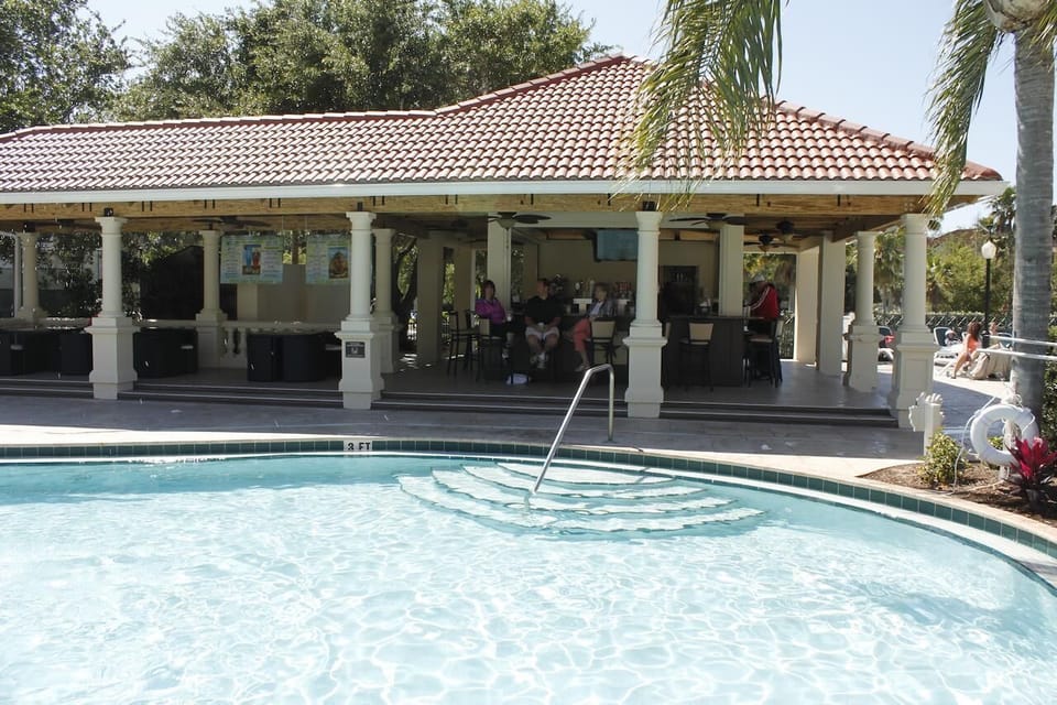 2 Huge swimming POOLs with loungers, umbrellas and tables