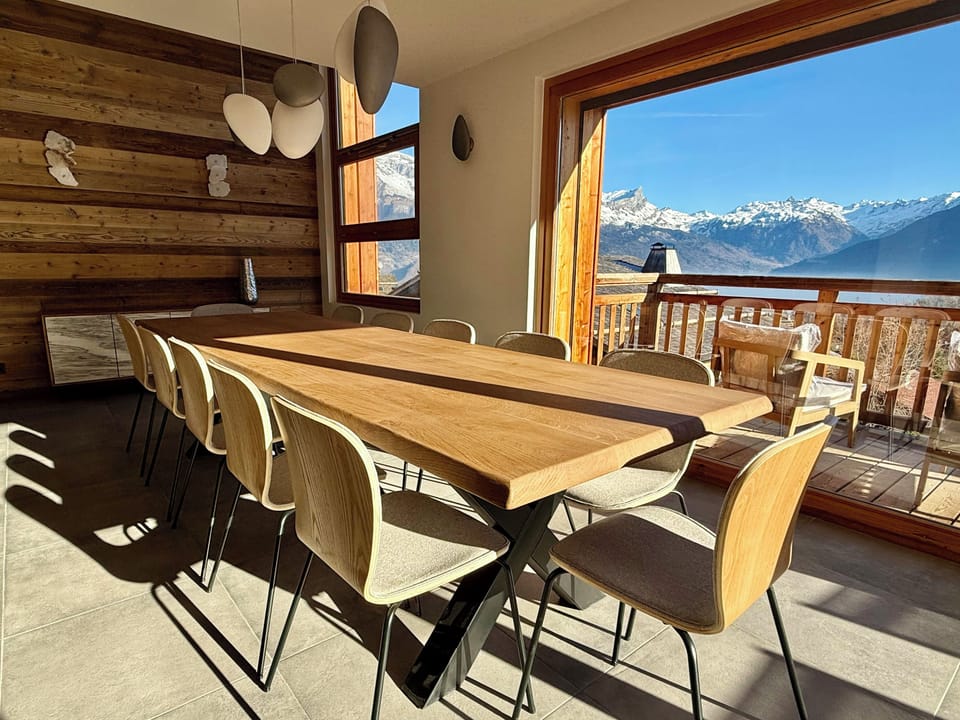 The dining room table can comfortably seat 14 people