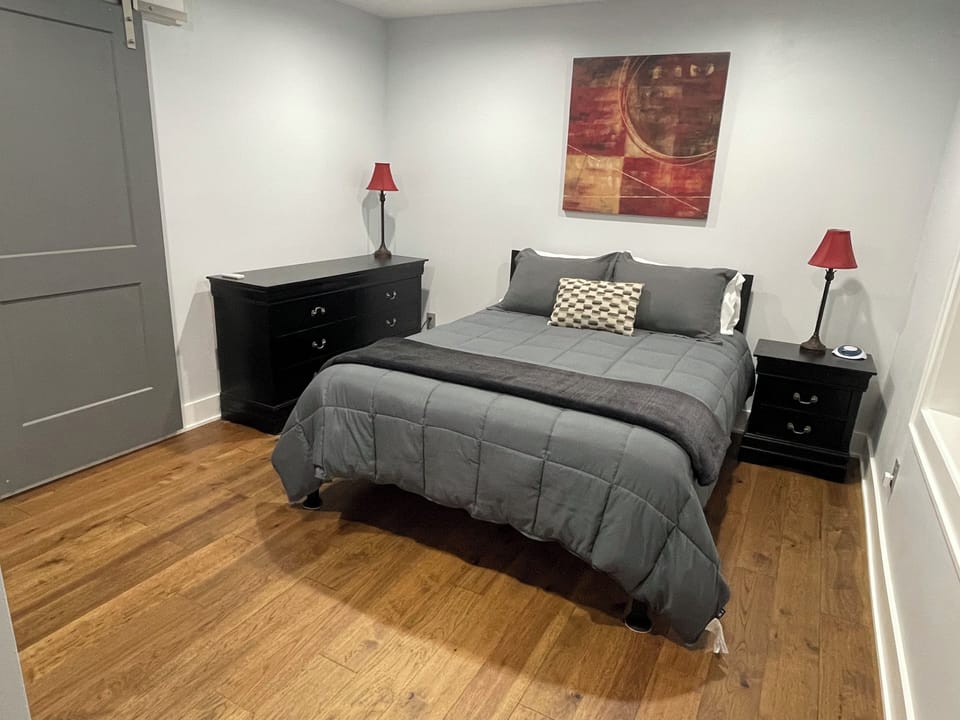 Lower level bedroom with queen bed