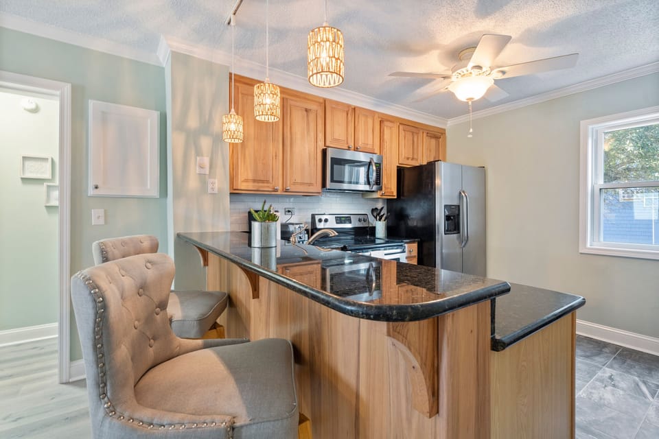 Island ideal for meal prep, morning coffee, or gathering with loved ones.