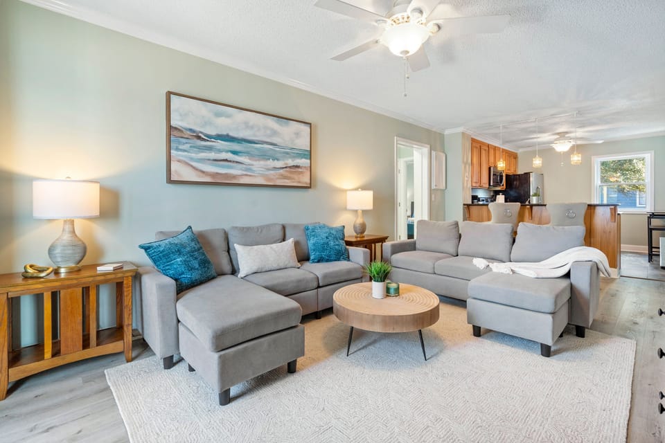 Airy living space with coastal vibes and a large sectional for gatherings.