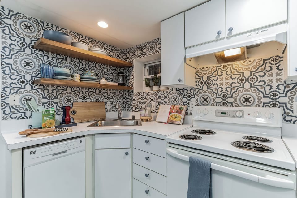 Newly renovated kitchen with fully stocked up kitchen items. 