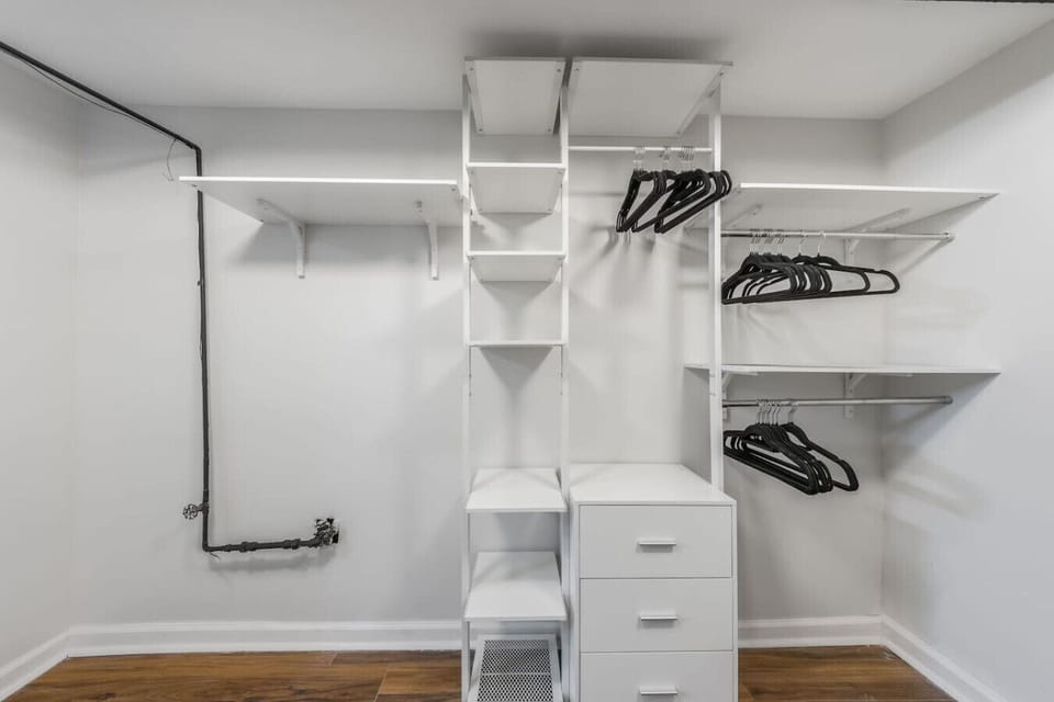 Newly added full bathroom with a sleek glass walk-in shower and modern finishes. Includes an adjacent walk-in closet for extra storage…spa-like, stylish, and perfect for extended stays or added privacy.