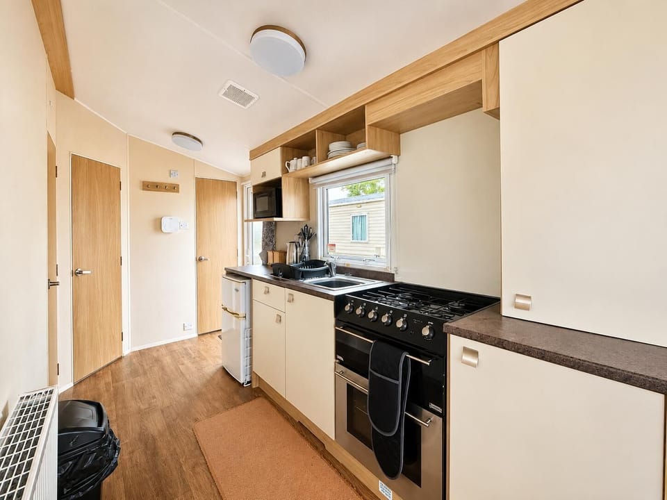 Bright modern kitchen with appliances to use