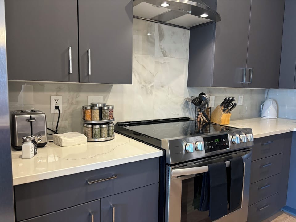Kitchen Amenities:  Spices, Utensils, Toaster, Coffee Maker, Blender, and More!