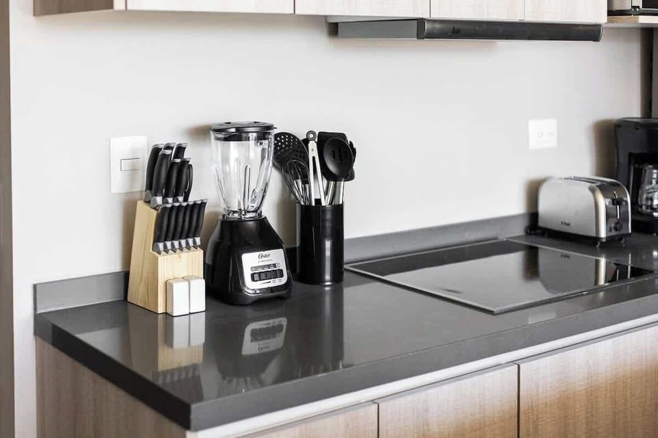 Fully equipped kitchen with modern appliances.