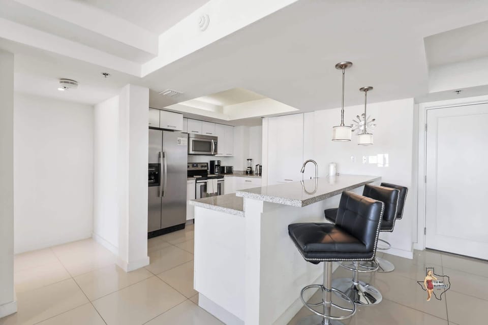 A fully equipped kitchen with a breakfast bar, for casual dining or morning coffee.