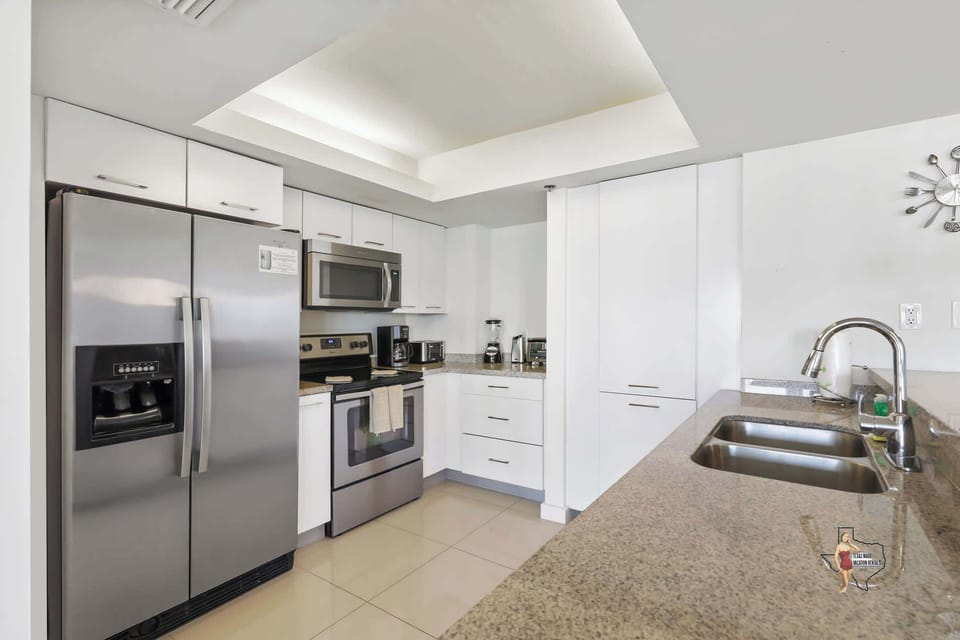 A modern kitchen featuring stainless steel appliances.