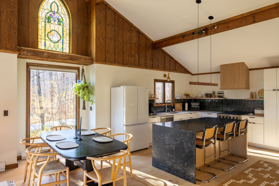 Our open concept dining room and kitchen, with enough seating for your whole group.