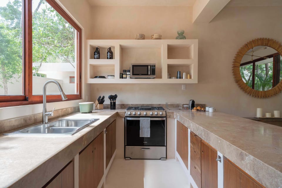 Spacious kitchen with bar seating, blending functionality and style.