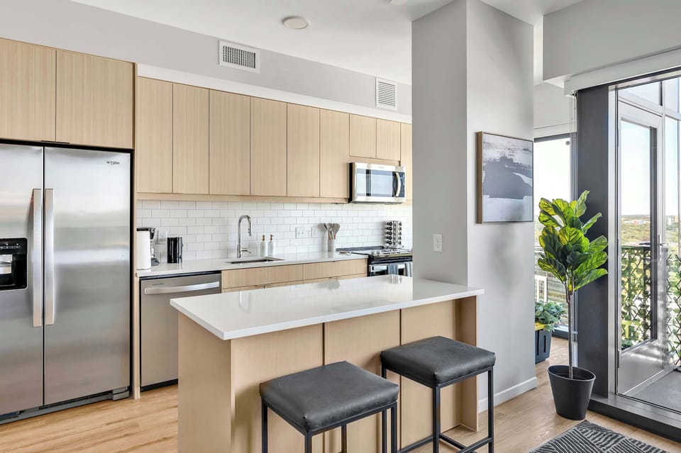 Kitchen with cooking essentials including microwave, oven, ice machine, dishwasher