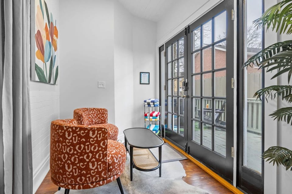 Unit 1: Sunroom leading to the backyard. (1st Floor)