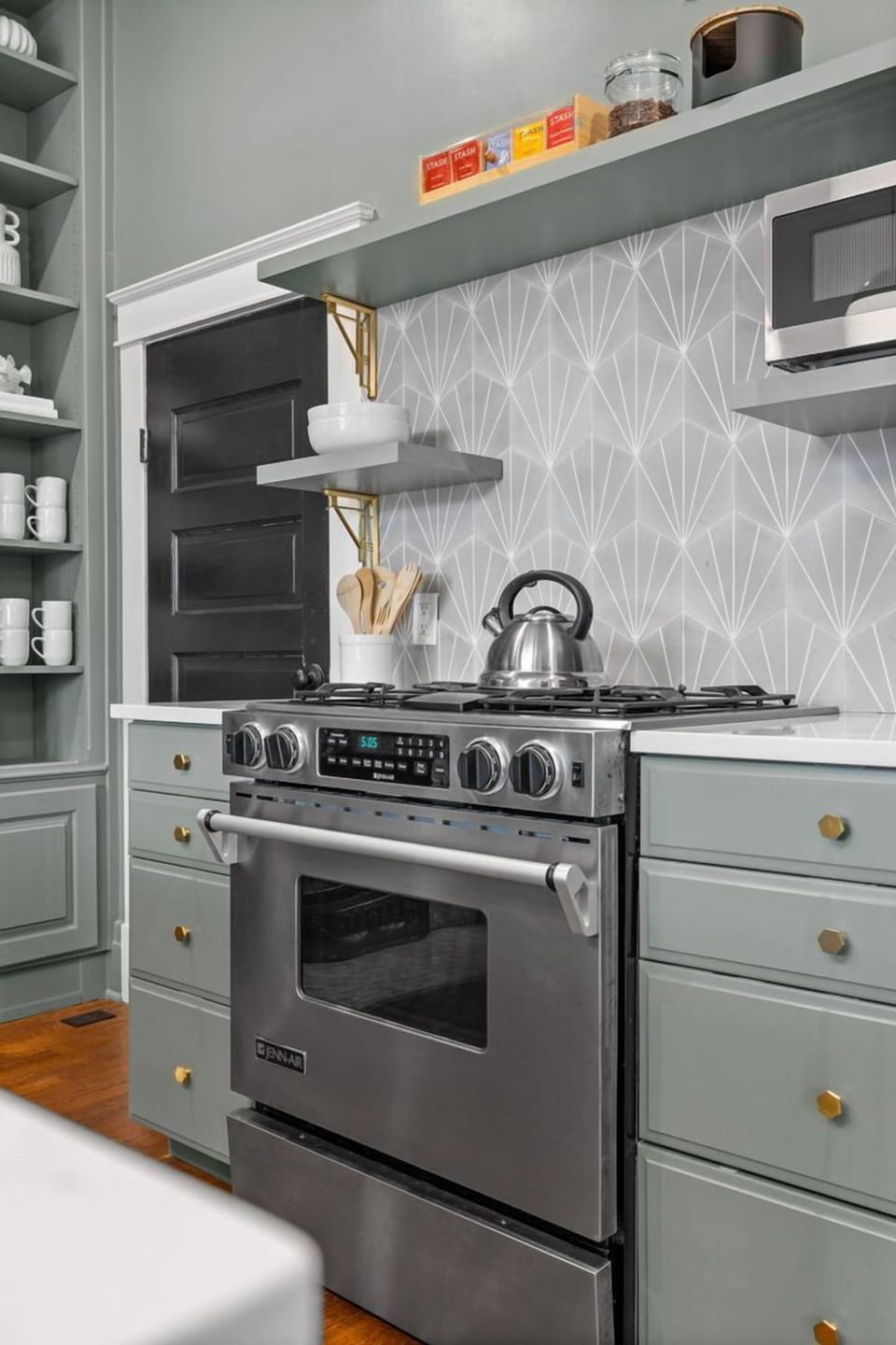 Unit 1: The kitchen on the first floor has stainless steel appliances. (1st Floor)