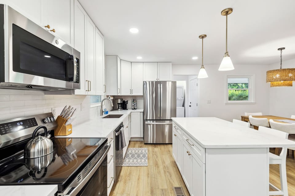 Modern kitchen with sleek appliances and ample counter space.