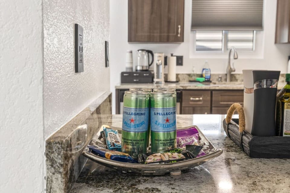Coffee & cocktail station w/ granite counters, stocked essentials, and a cozy spot to start or end the day.