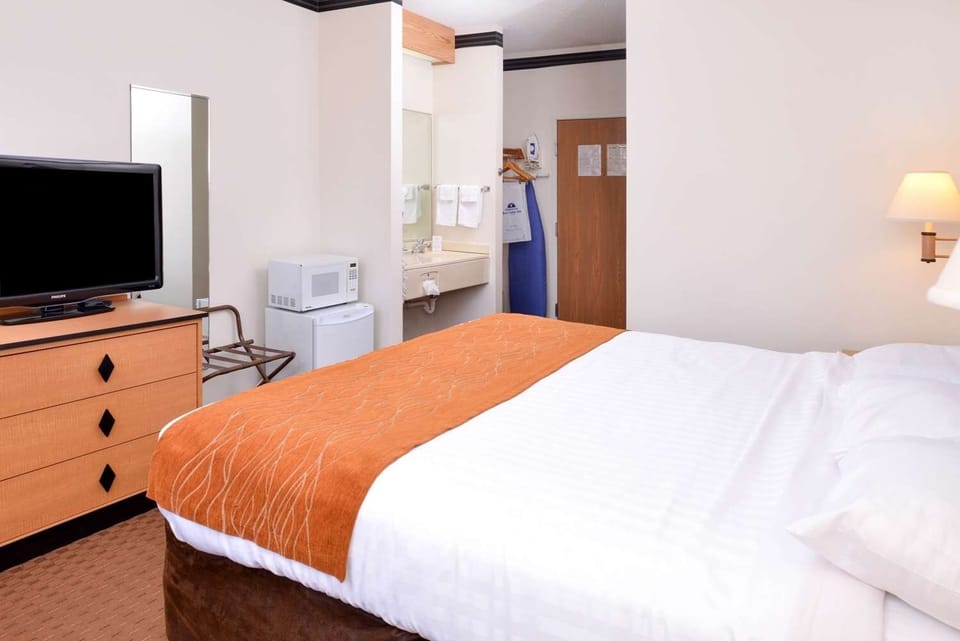 Spread out comfortably with mini-fridge convenience and easy room access.