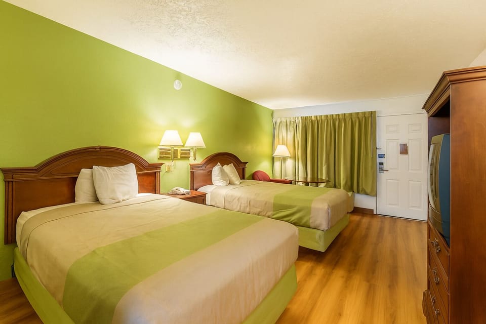 Relax together in a spacious two-bed room for easy sharing.