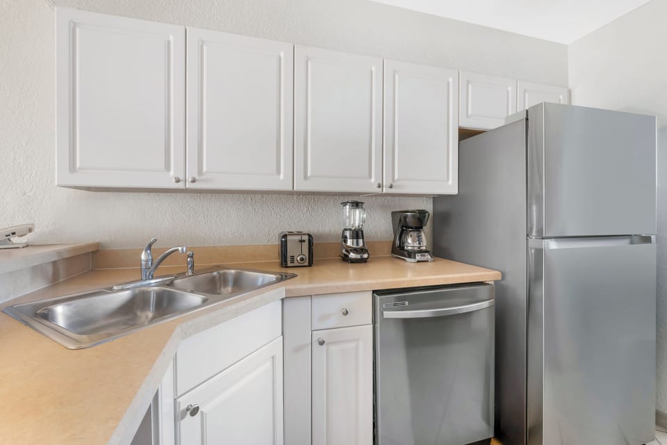 Brew morning coffee in a bright kitchen with modern finishes.