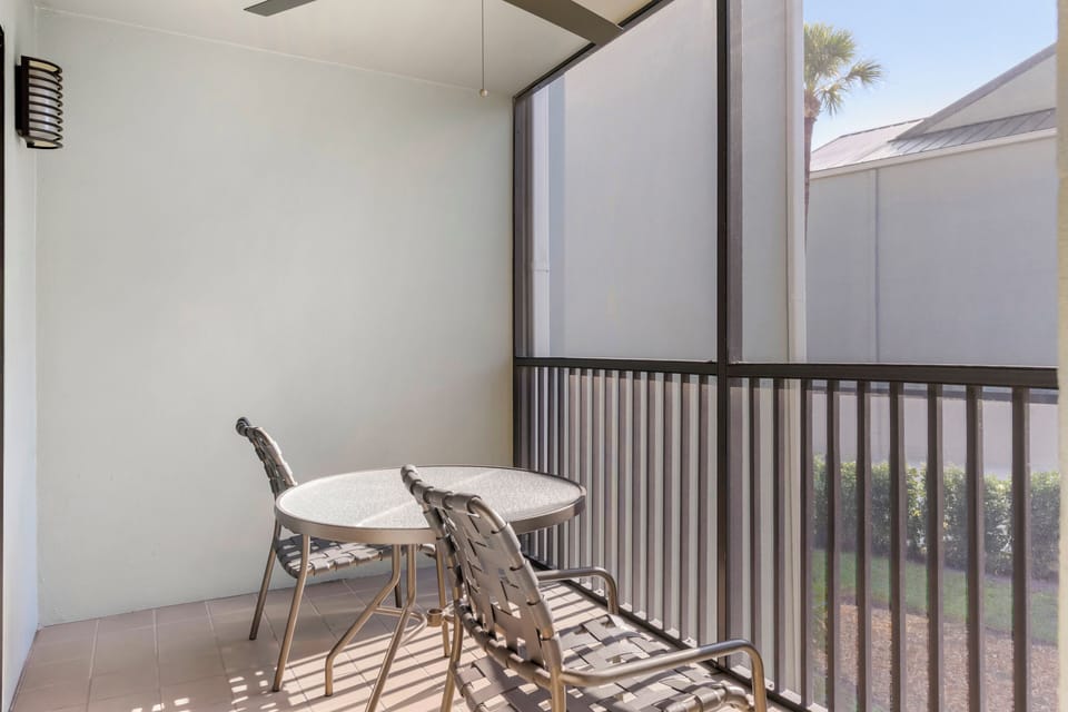 Sip morning coffee on the breezy screened-in balcony.