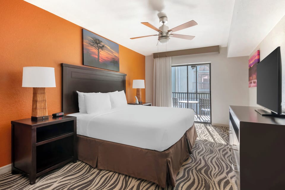 Drift off in a bright king room with balcony views.