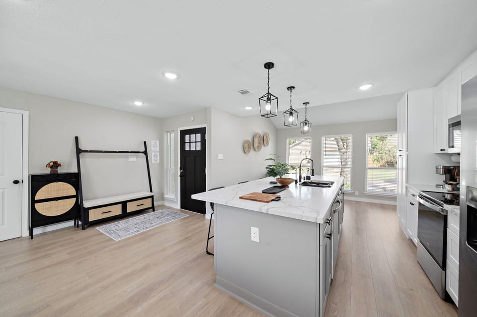 Fridge dispenses water and ice. Stainless steel appliances.