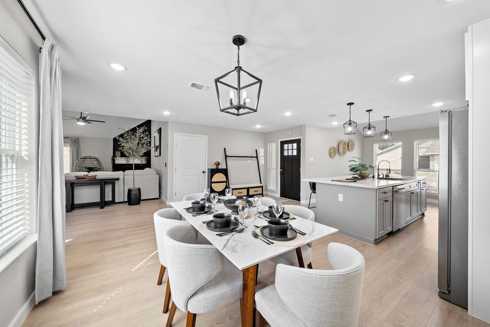Spacious dining table that sits 6 with full tableware and silverware included.