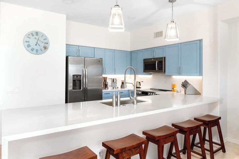 Prepare meals in a fully stocked kitchen, then step out onto the lanai to enjoy your food with views of the surrounding tropical landscape.
